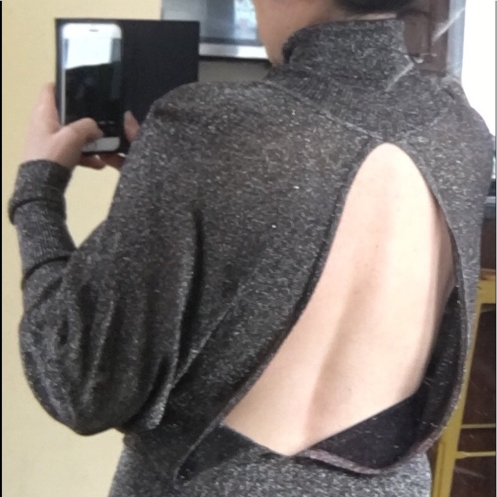 Metallic silver knit blouse . Open back. S/M